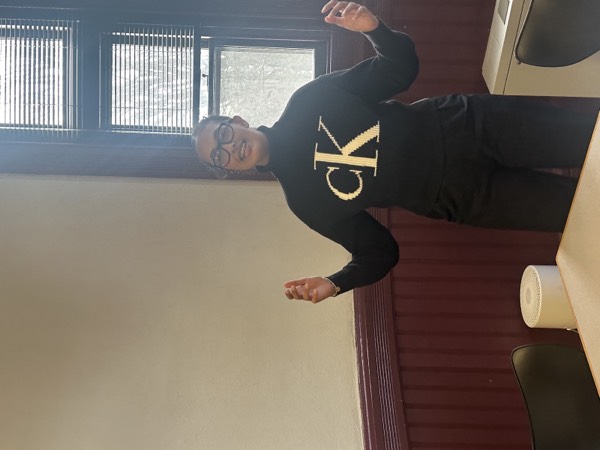 Online debate student speaking at Cambridge tournament